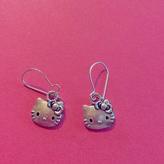 Earrings Are Sterling Sliver Have A Hello Kitty Face Charm On Them, From Early 2000's. Bright Sliver Dangling Earrings Are Cute For Any Age! Have A Loop In Back To Hold Earrings On. Light Weight To Wear! All Made To Order By, Meowchel Cute Nickel-free Metal Earrings, Cute Nickel Free Metal Earrings, Cute Hypoallergenic Metal Earrings, Cute Silver Dangle Jewelry, Silver Cat Design Jewelry With Cat Ears, Silver Cat Ears Jewelry, Cute Silver Drop Earrings, Hypoallergenic Silver Cat Ears Earrings, Hypoallergenic Silver Cat Ears Jewelry