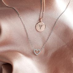 Our open heart pendant is a timeless expression of love. It’s the sweetest gift for yourself or for someone you hold close to show them just how much you care for them. With sparkling cubic zirconia and a dainty chain, this piece is perfectly flirty and feminine. 14KT yellow, rose or white gold plated AAAAA Cubic Zirconia Measurements: Diameter: 8mm (.3”) Chain length: 18”+2” extender Dainty Pendant Necklace, Dainty Choker Necklace, Heart Choker Necklace, Open Heart Necklace, Dainty Necklaces, Dainty Choker, Expression Of Love, Simple Addition, Heart Choker