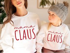 Mama Claus Mini Claus Sweatshirt| Family Claus Sweatshirt| Matching Family Christmas Sweatshirts| Mom Christmas Sweatshirts Ideal for any situation, a unisex heavy blend crewneck sweatshirt is pure comfort. These garments are made from polyester and cotton. This combination helps designs come out looking fresh and beautiful. The collar is ribbed knit, so it retains its shape even after washing. There are no itchy side seams on these sweaters.  .: 50% Cotton 50% Polyester .: Medium-heavy fabric (8.0 oz/yd² (271.25 g/m .: Loose fit .: Sewn in label .: Runs true to size Diy Mom Shirts, Mom And Mini Outfits, Mama And Mini Sweatshirts, Mini Outfits, Mini Outfit, Mama And Mini, Matching Mom, Matching Sweaters, Baby Unisex