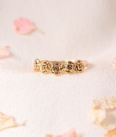 This hand-carved band features a halo of rosebuds, designed to enrapture you within the Divine love of your angels and serve as a reminder of your innate perfection and beauty. Available in 14k Yellow, Rose or White Gold No Stones Roses have long been cherished and sacred within my heart. My birth-month flower, fondest fragrance in its gentility, the color most representative of my soul’s auric field, I seek to discover more roses each time I return to Paris - kept illuminated within the stained Elegant Promise Jewelry With Rose Design, Rose Gold Wedding Jewelry With Rose Details, Rose Gold Wedding Jewelry With Roses, Dainty Rose Jewelry For Anniversary, Dainty Rose Detailed Jewelry For Anniversary, Rose Design Fine Jewelry For Wedding, Elegant Adjustable Rings With Rose Details, Elegant Adjustable Rings With Roses, Adjustable Elegant Rings With Roses