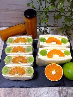 sliced oranges and kiwi slices on a cutting board