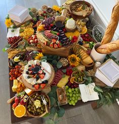 a table filled with lots of different types of food and desserts on it's sides