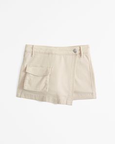 High rise utility skort in a soft twill fabric, with on-trend wrap details, front cargo-style pockets, built-in shorts and an elasticated waistband for maximum comfort. Beige Short Skort With Pockets, Wrap Skort, Cargo Style, Abercrombie Kids, Pocket Bag, Twill Fabric, Size 13, Oatmeal, Built In