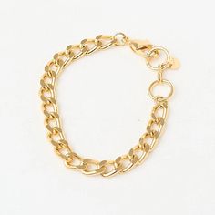 The Fine Grumet Chain Bracelet is a classic and elegant piece that adds a refined touch to your look. Crafted with a fine grumet link chain, this bracelet is gold plated to provide a luxurious shine. The minimalist design of the fine chain makes this bracelet versatile, perfect for daily wear or to complement more formal outfits. Its 16 cm size ensures a comfortable fit on the wrist, making it a timeless and sophisticated choice. The gold plating adds warmth and elegance to the Fine Grumet Chain Bracelet, enhancing the beauty of the grumet links. It’s ideal for those seeking a classic and understated piece of jewelry that adapts effortlessly to various styles and occasions. Wear the Fine Grumet Chain Bracelet alone for a delicate look or layer it with other bracelets to create a more elabo Classic Gold Plated Chain Bracelet With Curb Chain, Classic Gold Plated Charm Bracelet, Classic Gold Plated Curb Chain Bracelet, Classic Gold-plated Charm Bracelet, Classic Gold-plated Curb Chain Bracelet, Minimalist Gold-plated Curb Chain Bracelet, Minimalist Gold Cuban Link Bracelet For Formal Wear, Minimalist Gold Plated Curb Chain Bracelet, Gold Minimalist Cuban Link Bracelet For Formal Wear