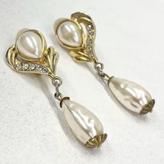 Vintage gold plated faux baroque pearl drip clip on earrings with clear diamante accents. Details -  Length - 5.5cm Width - 1.8cm Metal - gold tone alloy Along with vintage costume jewellery you will also find a huge collection of Uranium, Cadmium, Selenium and Spinel uv reactive jewellery. Please take a look at my other listings. Vintage Pearl Earrings, Uv Reactive, Vintage Pearl, Vintage Pearls, Baroque Pearls, Pearl Drop, Vintage Costumes, Vintage Gold, Clip On