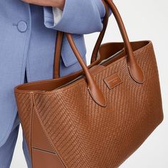 London Woven Leather Tote Bag in Tan Woven Leather Luxury Brown Woven Leather Satchel, Classic Intrecciato Weave Everyday Shoulder Bag, Classic Intrecciato Weave Shoulder Bag For Everyday, Designer Brown Bags In Woven Leather, Classic Intrecciato Shoulder Bag For Everyday, Classic Intrecciato Weave Shoulder Bag For Daily Use, Luxury Bags With Interwoven Design For Everyday Use, Designer Brown Bag With Woven Leather, Classic Everyday Shoulder Bag With Intrecciato Weave