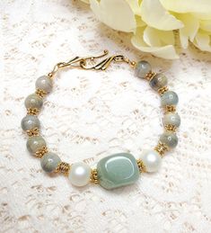 Soft Sage Green Gemstone Bracelet, Womens Bracelet, Womens Jewelry, Beaded Bracelet, Mixed Greens and Gold Accents - Etsy Elegant Jade Crystal Bracelet With Gemstone Beads, Elegant Aventurine Beaded Bracelets For Healing, Gold Jade Bracelets With Natural Stones, Elegant Aventurine Bracelet Jewelry, Elegant Aventurine Bracelet, Elegant Amazonite Bracelets As A Gift, Gold Jade Crystal Bracelet With Natural Stones, Elegant Beaded Pearl Bracelet For Healing, Gold Beaded Amazonite Bracelets