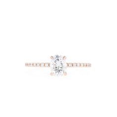 a diamond engagement ring on a white background