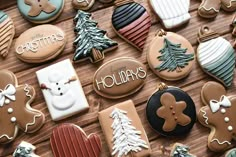 christmas cookies are arranged on a wooden table