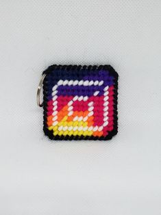 These are keychains with the Instagram logo. Made of plastic canvas Car Dice, Dominican Republic Flag, Logo Instagram, Instagram Logo, Notebook Cover, Plastic Canvas, Wall Hanger, Pixel Art, Keychains