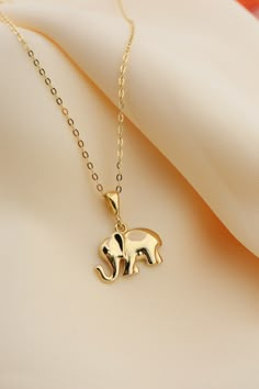 14k Solid Gold Elephant Necklace, Good Luck Charm Necklace, Dainty Gold Pendant, Animal Necklace, Minimalist, Gift for Her, Everyday Jewelry This solid gold dainty Necklace is made entirely from 14k solid gold. * Jewelry is packaged and shipped in a delicate jewelry gift box. * If you are purchasing it as a gift, please feel free to add a personal note. Anniversary, Gift For Wife, Christmas Gift Gold Kt: 14K solid gold * Guaranteed Authentic 14k Gold, NOT Plated Or Filled * Stamp: 14K Elephant Locket Gold, Dainty Gold Pendant, Elephant Pendant Gold, Animal Pendant Necklace, Minimalist Accessories Jewellery, Gold Elephant Pendant, Elephant Necklace Gold, Bridal Foot Jewelry, Gold Dainty Necklace