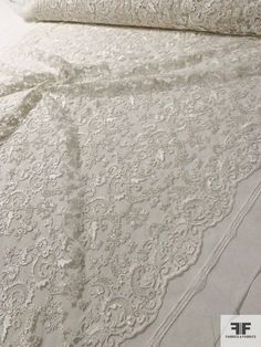 This silk white intricate floral embroidered double-scalloped fine tulle designer fashion fabric with sequins is an outstanding bridal fabric. SKU: 12271 Content: Polyester Color: Silk White Width: 51 inches This fabric is a last cut and no longer in production. Once sold out, we are unable to get more. Luxury White Sequin Fabric With Lace Work, Elegant White Sequin Fabric With Intricate Embroidery, White Embellished Organza Embroidered Fabric, White Lace Embroidered Fabric With Sequins, Elegant White Sequin Fabric With Floral Applique, Bridal Fabric, Fashion Fabric, White Fabrics, Lace Shorts