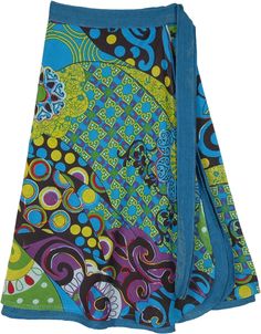 A blue-toned wrap skirt with a beautiful and bold floral print and colorful embroidery details.  This wrap skirt has two layers with the bottom layer as stonewashed blue and the upper layer printed floral; creating a flowing look and an artistic groove. #tlb #WrapAroundSkirt #Stonewash #beachwrap #Floral #Printed #bohemianfashion #WrapSkirt #HippieSkirt #FloralPrint Bohemian Floral Print Flowy Wrap Skirt, Bohemian Batik Print Skirt For Summer, Bohemian Batik Print Summer Skirt, Summer Bohemian Batik Print Skirt, Blue Bohemian Wrap Skirt For Festival, Blue Bohemian Flowy Wrap Skirt, Blue Wrap Skirt For Spring Beach Outings, Blue Wrap Skirt For Beach And Spring, Blue Long Wrap Skirt For Festival