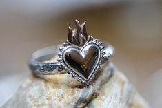 "I created this beautiful ring from a solid sterling silver floral patterned band, 3.4mm wide.  Upon it I soldered a gorgeous 10x13mm (1/2\" tall) flaming heart, made from sterling silver and bronze.  You may choose the shiny polished version or the darkened/antiqued and polished style.  Both are pictured. Any Size. Gift boxed with bow." Sterling Silver Polished Heart Ring For Wedding, Sterling Silver Heart Ring With Polished Finish For Wedding, Silver Heart-shaped Engraved Promise Ring, Nickel Free Heart Shaped Anniversary Rings, Nickel-free Heart Shaped Anniversary Rings, Unique Heart-shaped Promise Ring, Sterling Silver Heirloom Heart Ring For Promise, Silver Heirloom Heart Ring, Elegant Nickel-free Heart-shaped Ring