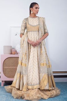 Nilofer – Sania Maskatiya International Designer Anarkali Set With Cutdana In Tissue Silk, Designer Tissue Silk Anarkali Set With Cutdana, Raw Silk Anarkali Set For Reception With Cutdana, Beige Anarkali Set With Zari Work, Floor-length Brocade Choli With Dupatta, Embroidered Tissue Silk Kurta For Reception, Beige Anarkali Traditional Designer Wear, Transitional Tissue Silk Salwar Kameez With Zari Work, Traditional Tissue Silk Kurta For Reception