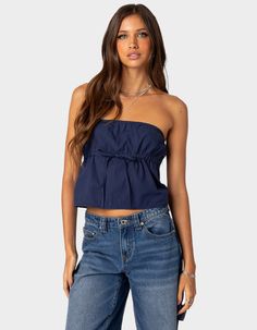 This Strapless Top Is Levels Over Any Other. It's Simple With A Bit Of Something Extra With A Cute Tie Front Detail To Level Up Your Next Outfit. Tube Top. Strapless Design. Under Bust Tie Strap. 100% Cotton. Model Wears Size S. Model Height Is 5'7. Item Care: Machine Wash At Maximum Of 30ºc, Do Not Bleach, Tumble Dry Low, Iron At A Maximum Of 110ºc, Do Not Dry Clean. | Edikted Reva Strapless Top Blue Tube Top, Fall School, Wardrobe Edit, Next Clothes, Strapless Tops, School Fits, Fit Inspo, Cotton Tops, Cute Tops