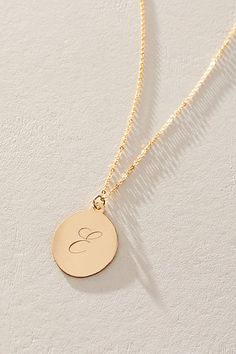 Just as effortless as it is elegant, this stunning necklace features an oval pendant with gorgeous cursive engraved initial for the ideal finishing touch. * 14k Gold Filled chain * Personalized, laser engraved, 14k Gold Filled 17x22mm oval pendant * Length: 20" * 5 days of production | Set & Stones Personalized Amelia Necklace at Free People in Gold Elegant Monogram Charm Necklace For Personalized Gift, Elegant Monogram Charm Necklace, Elegant Initial Necklace With Monogram Round Pendant, Elegant Sterling Silver Monogram Charm Necklace, Elegant Gold Initials Necklace, Elegant Round Monogram Name Necklace, Elegant Initial Pendant Necklace With Polished Finish, Elegant Polished Initial Pendant Necklace, Gold Oval Pendant With Initials Jewelry