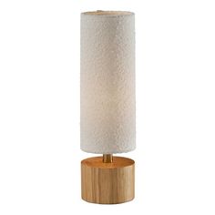 a wooden table lamp with a white fabric shade on the top and wood base around it