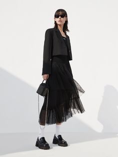 MO&Co. Women's Elasticated Ruffle Laced Skirt Features : - Midi length with a flowy fit- Elasticated waist- Asymmetrical, tulle ruffle layers design Code: MBC1SKTT11The back length of size S is 82cmMATERIALS & CARE Material: 100% PolyesterGentle machine wash below 30°CDo not bleach, hang to dry in the shadeDo not tumble dry, do not ironDo not dry clean, do not soakDo not rub, wash separately in mesh bagWash with neutral detergentPlease select your own size in the size chart according to your fig Tulle Skirt Fashion, Ruffle Skirt Black, Ruffle Skirt Outfit, Short Tulle Skirt, Layers Outfit, White Lace Skirt, Black Lace Skirt, Layered Tulle Skirt, Lace Midi Skirt