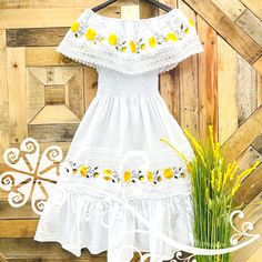 White Dress With Floral Embroidery For Fiesta, Spring Fiesta Dress With Multicolor Embroidery, Peasant Cotton Dress For Garden Party, Peasant Style Beach Dress With Floral Embroidery, Peasant Style Cotton Dress For Garden Party, Spring Festival Dresses With Floral Embroidery, Fitted Multicolor Embroidered Dress For Vacation, Spring Floral Embroidered Dress For Festival, Summer Fitted Dress With Embroidered Hem