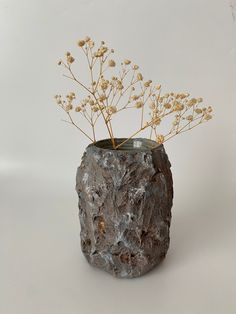 a vase that has some flowers in it