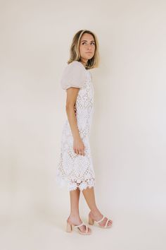 We are loving our new Exclusive - Helena Dress! Now in 2 colors, this lace beauty can take you anywhere! With the lace bodice + contrasting tulle sleeves, what more could you want?! Size inclusive from XS-3X. Details Lace detailing on the bodice Puffy tulle sleeves Zipper + hook and eye closure in back Fully lined Fitted dress Short sleeves*Lace placement and pattern may vary Sizing *Measurements are taken with item hanging and fabric unstretched.* SIZE LENGTH BUST SHOULDERS WAIST XS 42" 32" 28" Feminine Lace Dresses With Lace Patchwork, Feminine Lace Midi Dress With Lace Top, Feminine Midi Dress With Lace Top, Feminine Lace Midi Dress With Lace Sleeves, Lace Midi Dress With Lace Top, White Midi Dress With Lace Bodice, Fitted Lace Bodice For Spring, Lace Top Midi Dress, Fitted Crochet Dress With Scalloped Lace For Spring