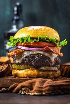 a hamburger sitting on top of a wooden cutting board