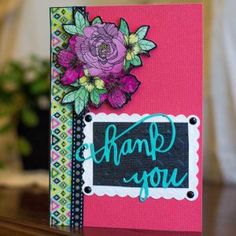 a thank you card with flowers on it