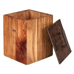 a wooden box with an open lid on it and a piece of wood in the middle