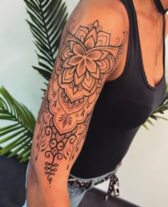 a woman with a tattoo on her arm