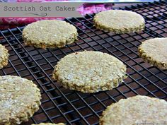 several cookies cooling on a grill with the words scottish oat cakes