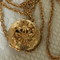 Vintage Gold Tone Locket. Dimensional Flowers Open to the Inside of Locket. Perfume or Picture Locket Pendent on Gold Tone Chain.  This locket is in good shape for its age.  Size: Round Locket Open to Inside: 1 1/8" X 1 1/4", Chain: 23" For other jewelry and vintage items see: www.VeryVictorianStudio.etsy.com. For sewing related items see my other shop: www.SewingRoomStore.etsy.com. Thank you for looking! Luxury Vintage Locket Necklaces, Cheap Vintage Gold Locket Necklace, Golden Pendant, Gold Pendent, Gold Locket Necklace, Picture Locket, Round Locket, Gold Locket, Jewelry Lookbook