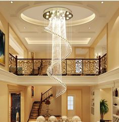 a living room filled with furniture and a spiral staircase