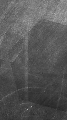 a black and white photo of an empty chalkboard