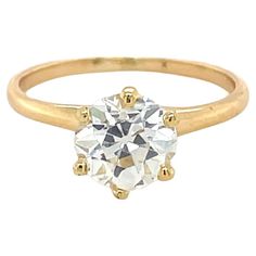 This late Victorian diamond engagement ring boasts a beautiful 1.55 carat old European cut diamond. Mounted within six claw prongs, this ring is elegant with a touch of history. Ring Size: 6 1/4 Metal: 14 karat yellow gold Gross weight: 1.68 grams Diamond Characteristics (insofar as the mounting permits): Color: H-I. Clarity: VS2-SI1. Edwardian Engagement Ring Antique, Antique Cushion Cut Diamond, European Cut Diamond Ring, Diamond Engagement Rings Cushion, Edwardian Engagement Ring, Victorian Engagement Rings, Contemporary Engagement Rings, Three Stone Diamond Ring, Engagement Ring Diamond Cut