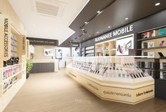 the inside of a cell phone store with shelves and signs on the wall, along with other items