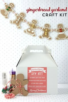 gingerbread garland and craft kit in a white box on a table with christmas decorations