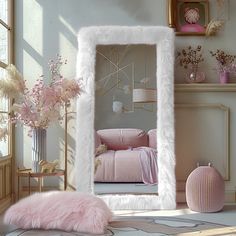 a mirror that is in the middle of a room with pink furniture and flowers on it