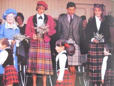 an old photo of people dressed in kilts