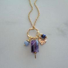 "~ ♦ ~ Higher Love Crystal Necklace ~ ♦ ~ ~ ♦ ~ Feel the energy of Universal & Angelic Love with these magical gemstones ~ ♦ ~ Details: * 15x10mm Chevron Amethyst Tube handcrafted paddle pendant * 6mm Faceted Lapis Rondelle * 6mm Angelite Rounds * Gold Heart Charm * 16mm Gold Twisted Circle * Gold Stainless Steel Cable Chain * Gemstone Drop measures 1.75\" (50mm) * Angelite brings the spiritual energies of power, healing, love, and protection. Wearing this stone is believed to have a calming eff Purple Bohemian Everyday Jewelry, Amethyst Charms Jewelry Gift, Amethyst Charms Jewelry For Gift, Purple Spiritual Jewelry For Everyday, Gift Amethyst Charms Jewelry, Spiritual Purple Jewelry For Everyday, Everyday Spiritual Purple Jewelry, Purple Charms Necklaces As A Gift, Purple Heart-shaped Bohemian Jewelry