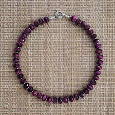 Purple Tigers Eye Necklace Brilliant Purple Color Shaped Into 6x10mm Faceted Rondelle Gemstones Silver Hematite Discs (1x4mm) Adds A Modern Look Length = 16" (About 41 Cm) All Components Are&Nbsp;925 Silver--Toggle, Lobster, Rings, Bali Beads Beads Are Imported Designed And Made By Hand In The Coachella Valley, California, Usa Longer Lengths Or Extension Available Quality Materials And Work No Dissapointments Silver Rondelle Gemstone Beads Jewelry, Sterling Silver Rondelle Gemstone Beads Jewelry, Sterling Silver Rondelle Beads For Jewelry Making, Sterling Silver Single Strand Beaded Necklaces, Silver Rondelle Gemstone Jewelry, Sterling Silver Rondelle Gemstone Beaded Necklace, Round Sterling Silver Single Strand Beaded Necklace, Sterling Silver Rondelle Jewelry With Silver Clasp, Sterling Silver Rondelle Necklace With Polished Beads