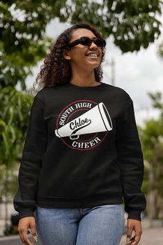 Personalized Cheer Shirt. This design can be customized with your text, team/school name and colors. Ask about group pricing! See Size Charts in the photos for sizing. Printed on a Black Heavyweight Crew Neck Sweatshirt Features: 8 oz./yd² (US) 13.3 oz./L yd (CA), 50/50 cotton/polyester, 20 singles Heather Sport colors: 60/40 polyester/cotton 2-end midweight fleece fabric Classic fit Air jet yarn for softer feel and reduced pilling Double-needle stitching at shoulders, armholes, neck, waistband Team-colored Crew Neck T-shirt For Cheerleading, Pre-shrunk Crew Neck Top For Cheerleading, School Spirit Letter Print Sweatshirt For Cheerleading, Black School Spirit Sweatshirt For Cheerleading, Black Collegiate T-shirt For Cheerleading, Black Crew Neck T-shirt For Cheerleading, School Spirit Sweatshirt For Fan Merchandise, Custom Logo Crew Neck Tops For Sports Season, Long Sleeve T-shirt With Letter Print For Cheerleading