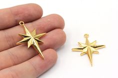 23x32mm 24k Shiny Gold Plated North Star Necklace Charm, Large North Star Pendant, Celestial Charm, Gold Charms, Gold Plated Findings Material      : Brass Color           : 24k Shiny Gold Plated Size              : 23x32mm Hole Size    : 2.5mm Quantity      : Options All Our Gold Models https://www.etsy.com/shop/Goldjewelrysupplier?ref=seller-platform-mcnav&section_id=39961356 All Our North Star Models https://www.etsy.com/shop/Goldjewelrysupplier?ref=seller-platform-mcnav&search_query=north+st Gold Star Jewelry For Christmas, North Star Pendant, North Star Necklace, Gold Charms, Gold Models, Necklace Charm, North Star, Plate Size, Star Charms