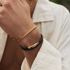 Featuring a clean and understated 18K gold barrel, this woven leather bracelet will add depth to your look by breaking up the metal. Its polished golden accents feature intricate clover detailing and a secure bayonet clasp for a comfortable fit. Wear it solo or stack it with your favourite gold rings for an instantly elevated look. ​​✓ 18K Gold & Leather✓ Water, Heat, Sweat Resistant✓ Hypoallergenic (No Green Skin)Model is 5'11 & Wears 7.5" Length. Men Gold And Leather Bracelet, Golden Bracelets For Men, Men’s Bracelet, Bracelet Photography, Boy Jewelry, Bracelets Outfit, Men's Leather Bracelet, Man Bracelet, Gold Bracelet Simple