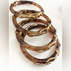 4 Bangles With Tortoise Carr Material And Snake Gold Hardware Detailing - Comes As A Set Purchased From A Jewellery Store In Switzerland Like New, In Very Good Condition Tortoise Shell Accessories, Elegant Tortoiseshell Bangle Jewelry, Elegant Brown Stackable Jewelry, Elegant Adjustable Tortoiseshell Jewelry, Elegant Adjustable Tortoiseshell Bracelets, Bangle Stack, Shell Accessories, Jewellery Store, Sugar Cravings