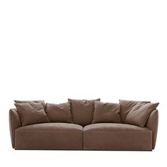 a brown couch sitting on top of a white floor