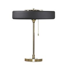 a black and gold table lamp on a white background with a chain hanging from the base