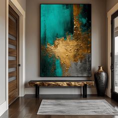 an abstract painting hangs on the wall above a wooden bench in front of a door