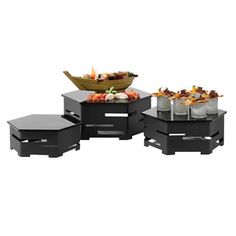 an assortment of black tables and stools with food on them in front of a white background