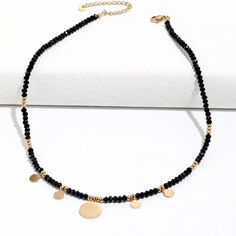 This one-of-a-kind Tori Black Beaded Necklace is sure to catch eyes with its bold mix of edgy black and glitzy gold. A shimmering statement piece for daring fashionistas, it'll add a modern touch to any look! #stylegameonpoint Size: 16 inches with 2 inch extender Materials: Stainless Steel 18K Gold Plated Black Faceted Beads For Party, Trendy Colorful Beaded Necklaces For Party, Trendy Round Beads Necklaces For Party, Trendy Round Bead Necklaces For Party, Trendy Round Beads Necklace For Party, Trendy Party Beaded Necklaces With Colorful Beads, Trendy Party Beaded Necklace With Colorful Beads, Gold Beaded Metal Necklaces, Black Faceted Beads Choker